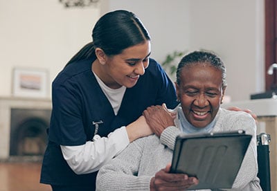 Patient and provider looking at a tablet.