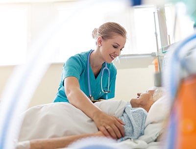 Medical Assistant treating elderly patient