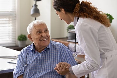 Doctor talking to an elderly patient