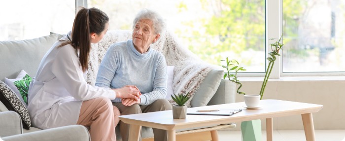 Doctor talking to elderly patient