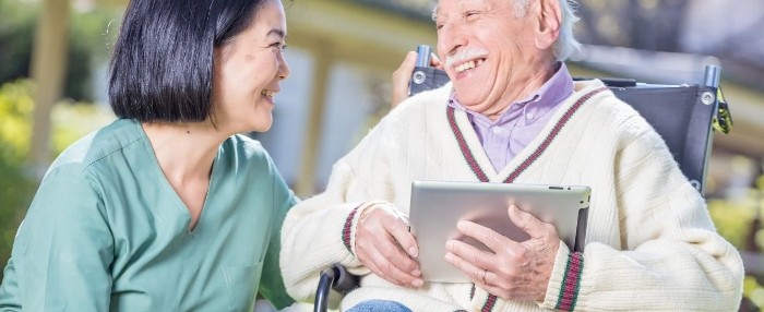 Nurse talking with elderly patient